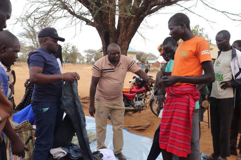 Giving out clothes to parents from the community